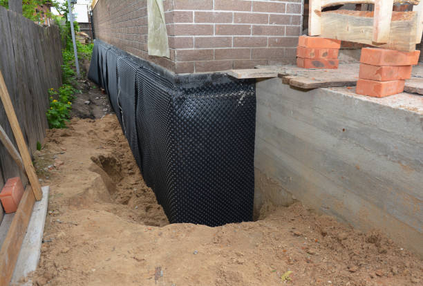 SJ Waterproofing Pros technician performing targeted Waterproofing assessment in Williamsburg, OH